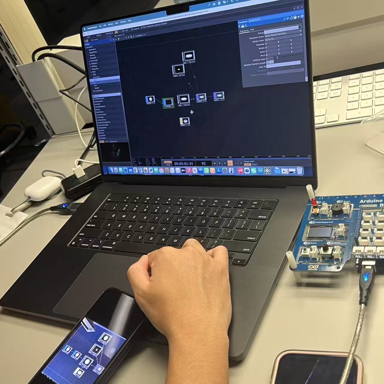 A node-based system was built in TouchDesigner to control lighting and scale effects.